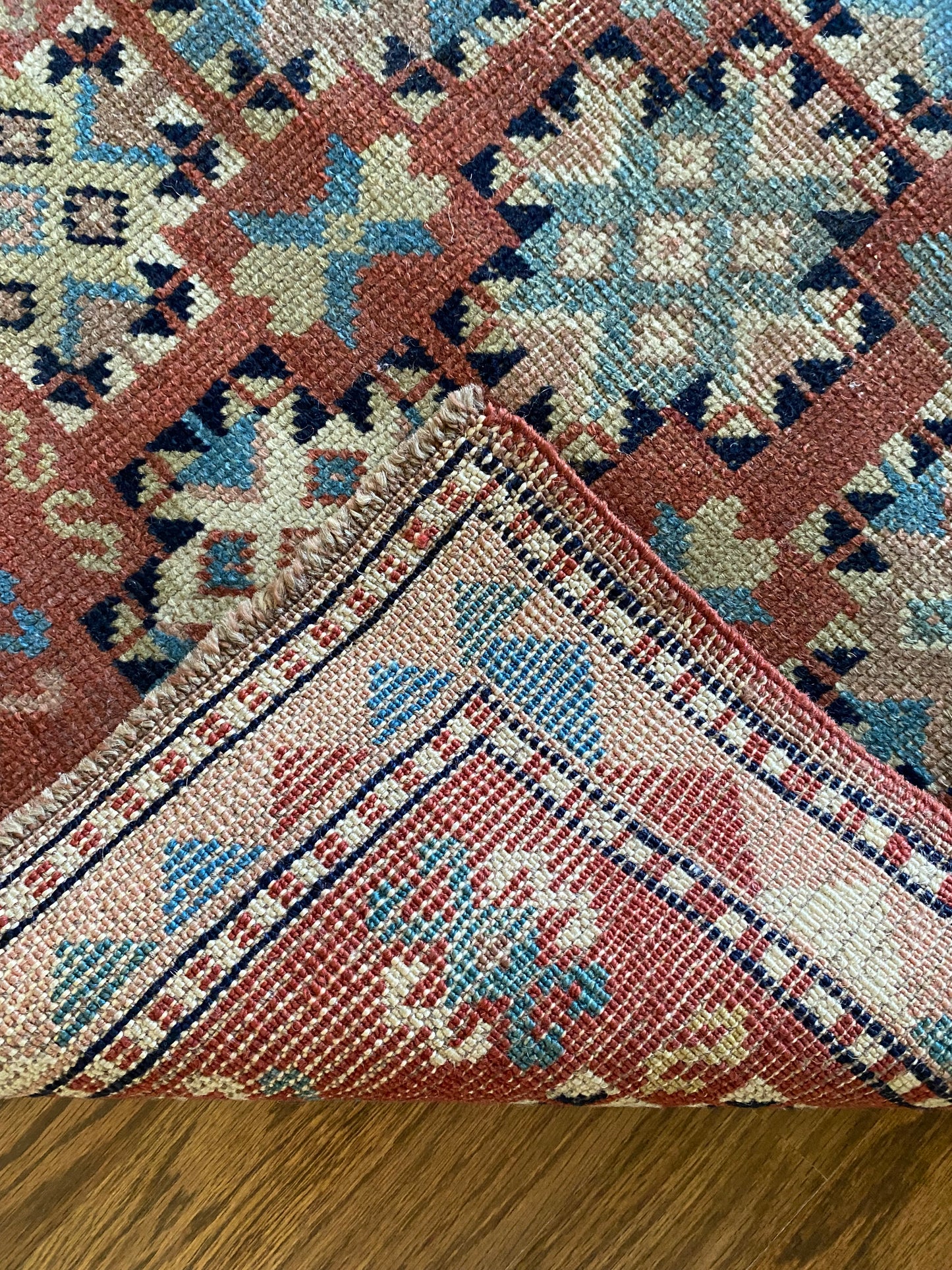Hand knotted wool rug backing and pile detail