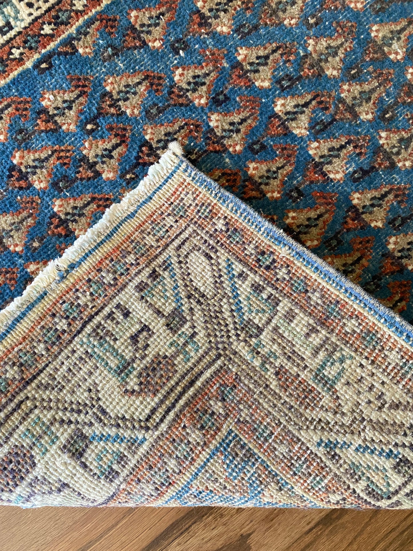 Hand knotted wool rug backing and pile detail