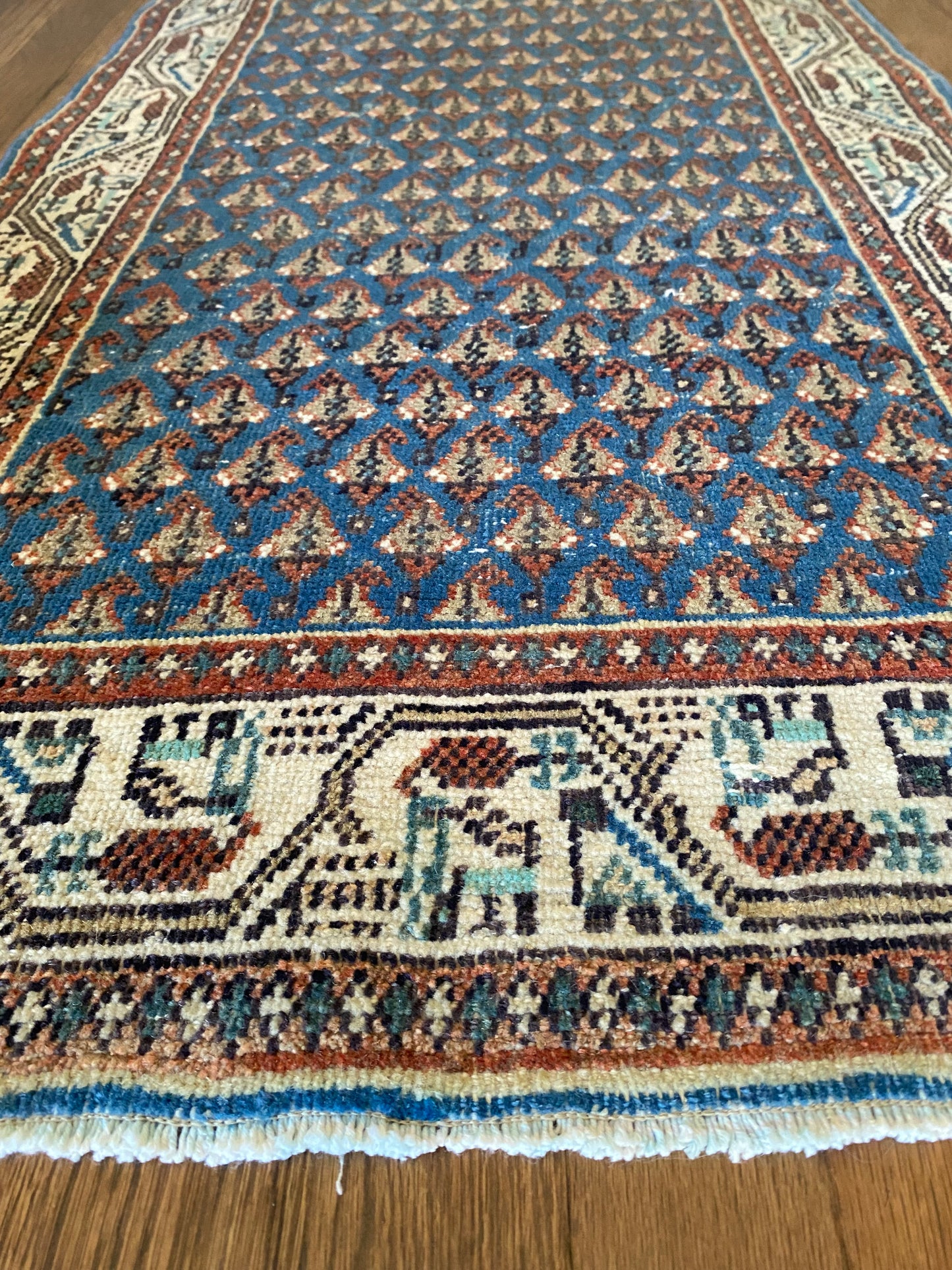 Small Persian rug rich blue tones styling