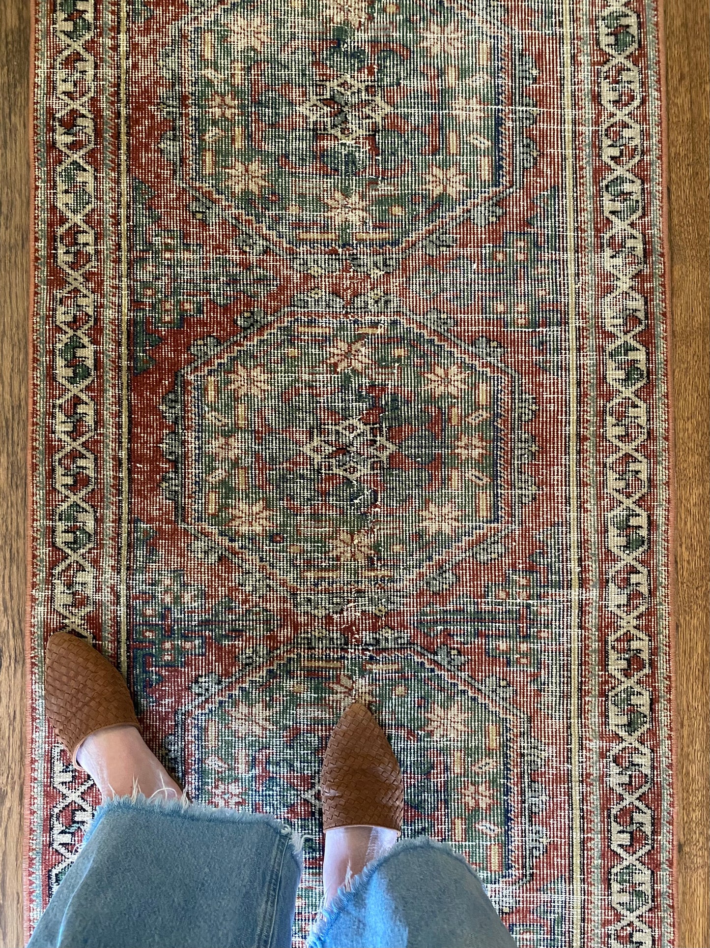 Faded red runner rug long narrow hallway styling