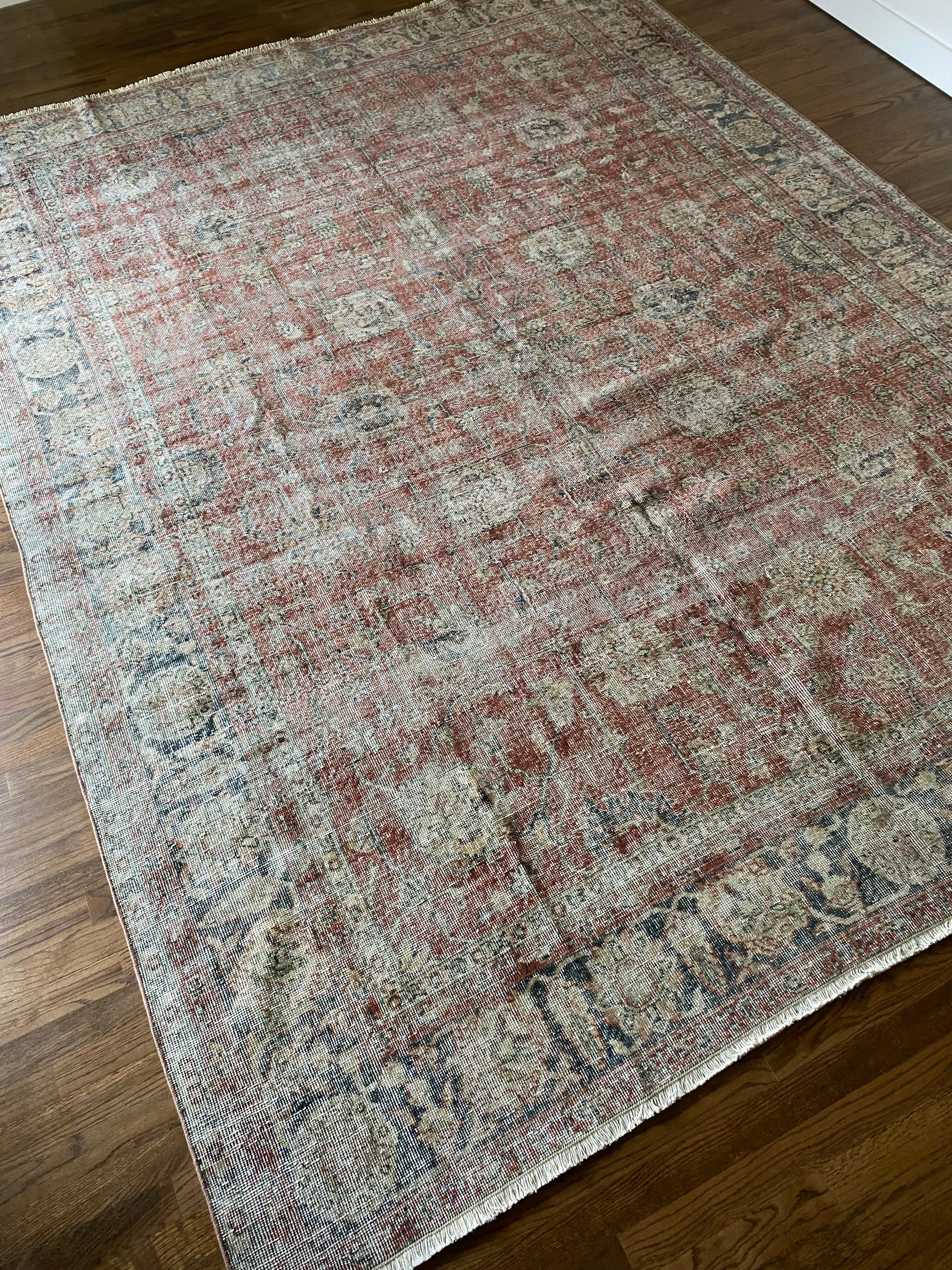 Large vintage area rug 8x10 muted tones styling view. 