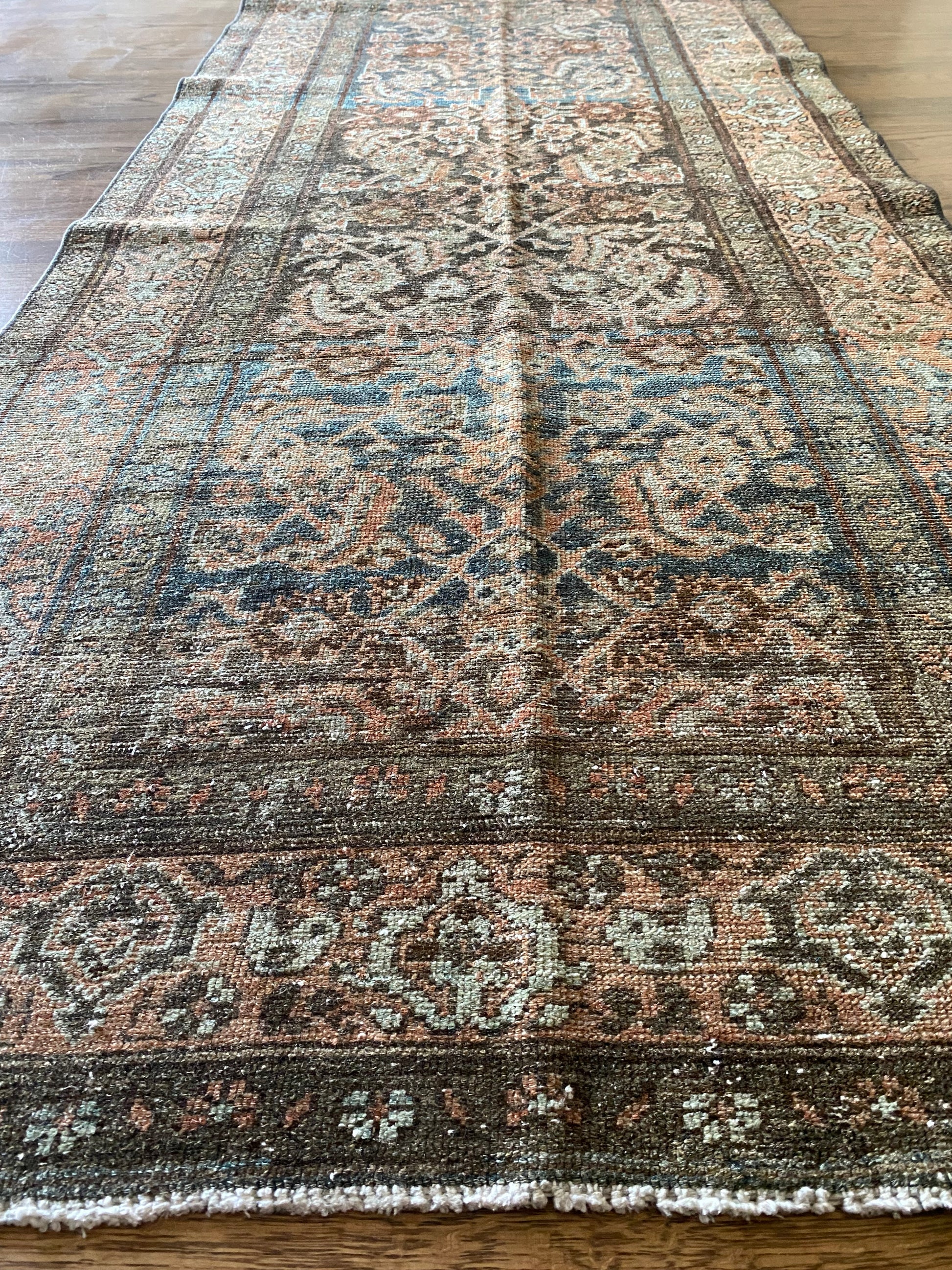 Antique Malayer rug detail faded tones and pattern