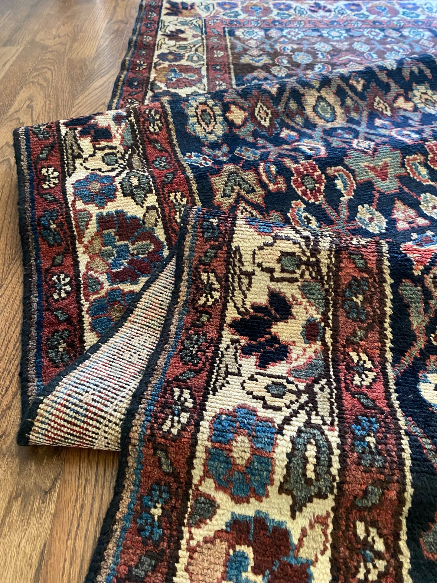 Close up antique Malayer runner showing texture