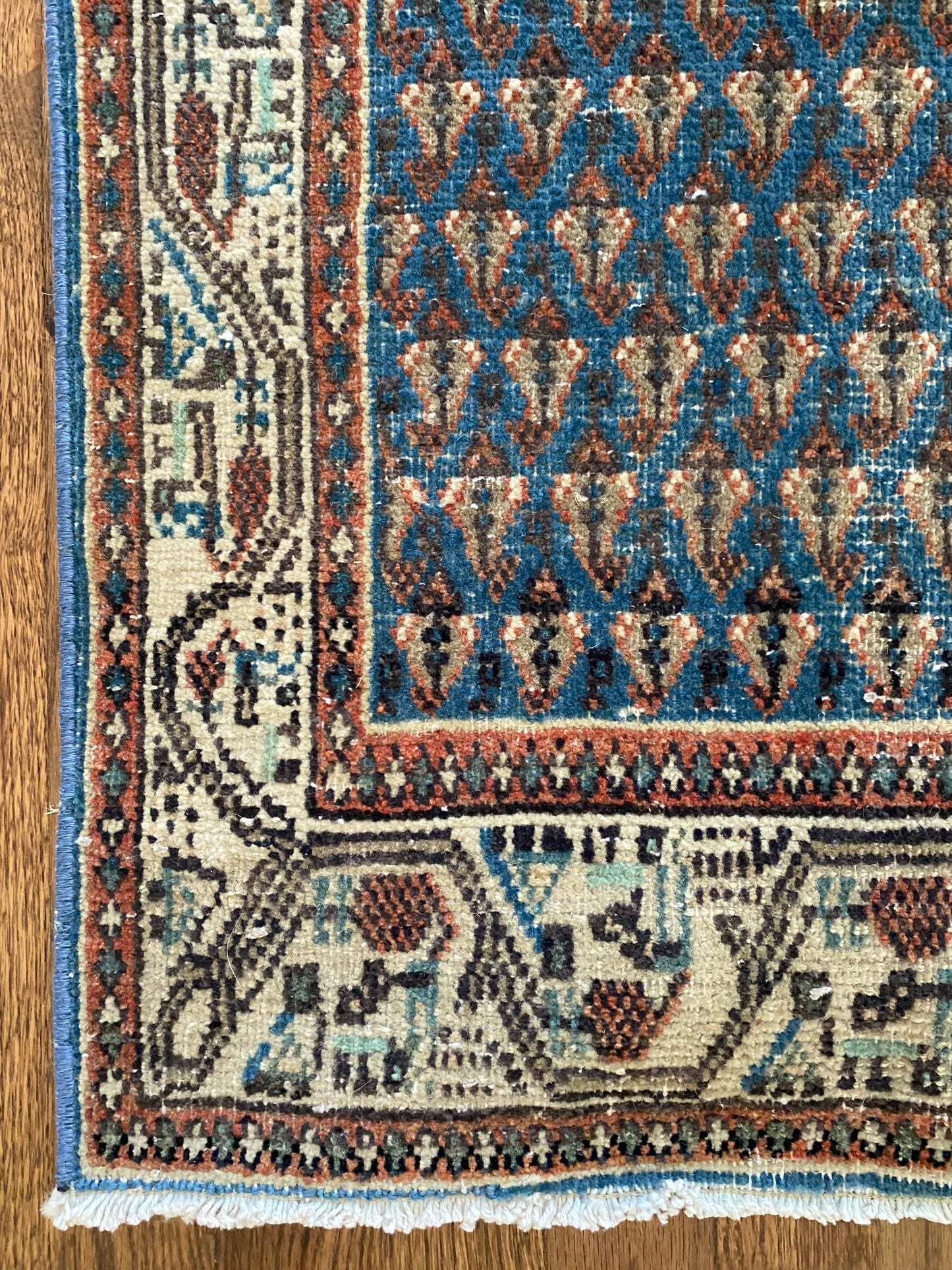 Blue vintage rug boteh motif detail