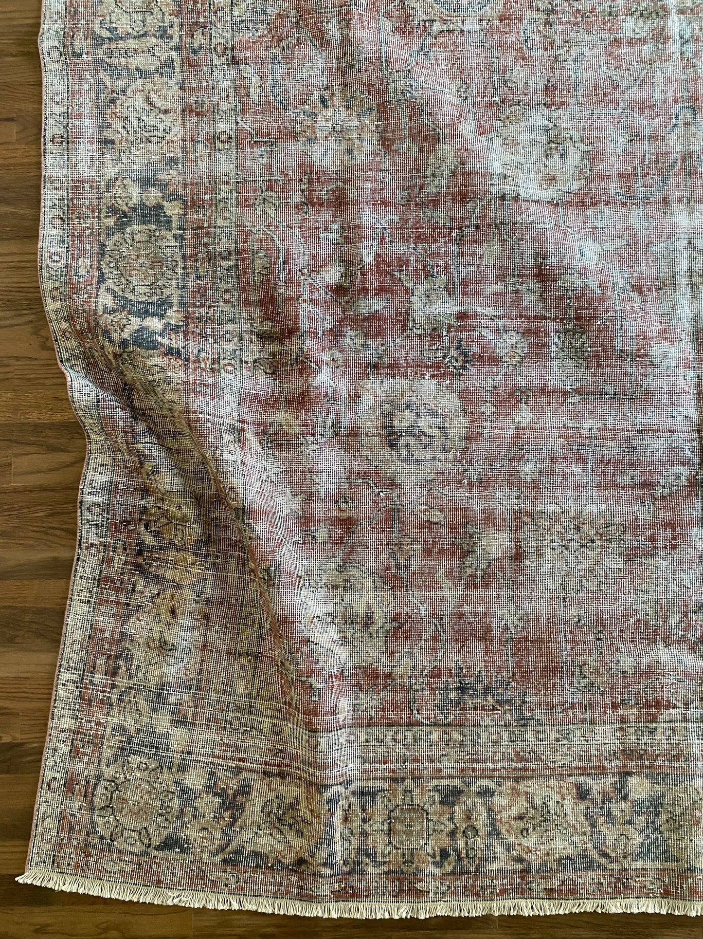 Hand knotted Turkish area rug 8x10 faded red tones. 