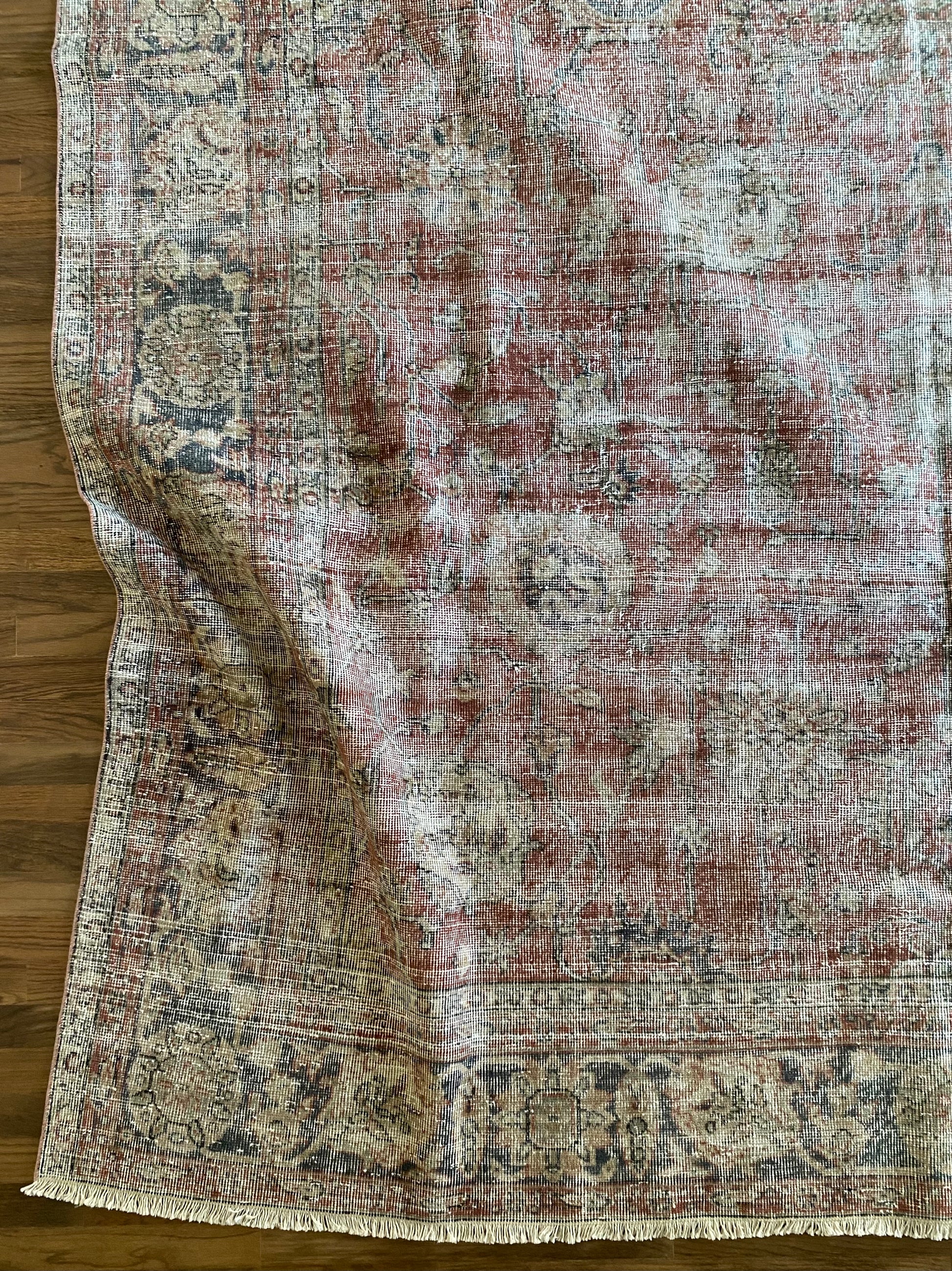 Hand knotted Turkish area rug 8x10 faded red tones. 