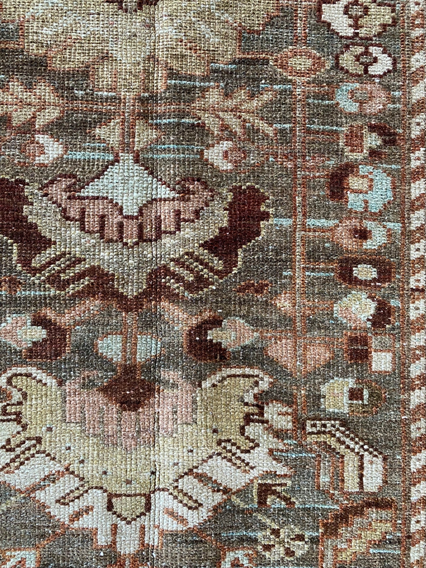 Close up antique runner showing texture and bold design