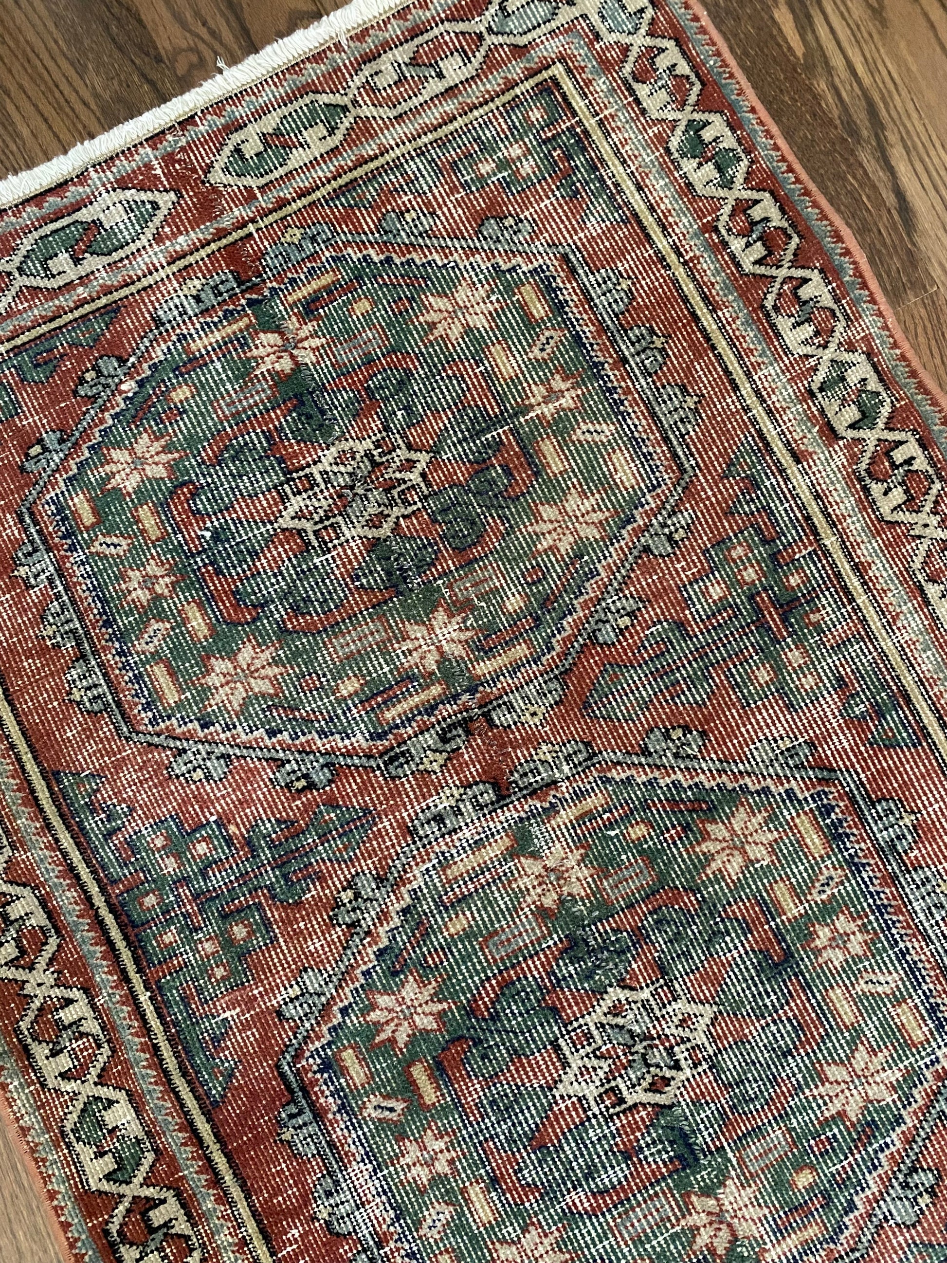 Close up vintage runner showing red and green tones