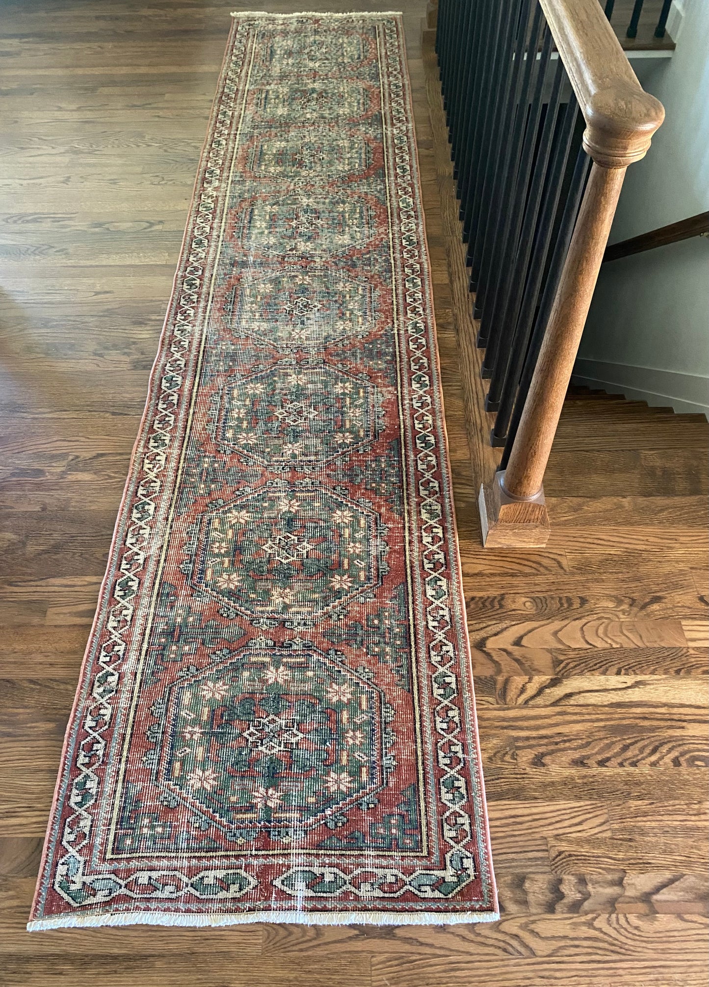 Vintage Turkish runner 2x11 faded red and green hallway rug full view